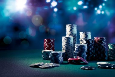 Live dealer dealing cards at a professional baccarat table